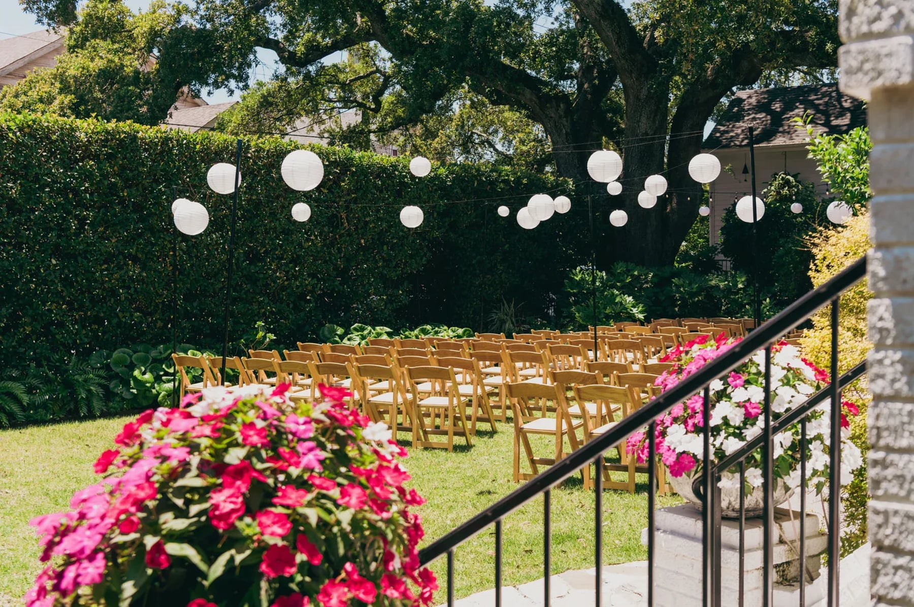 Outdoor wedding ceremony chairs under lanterns at The Mazant