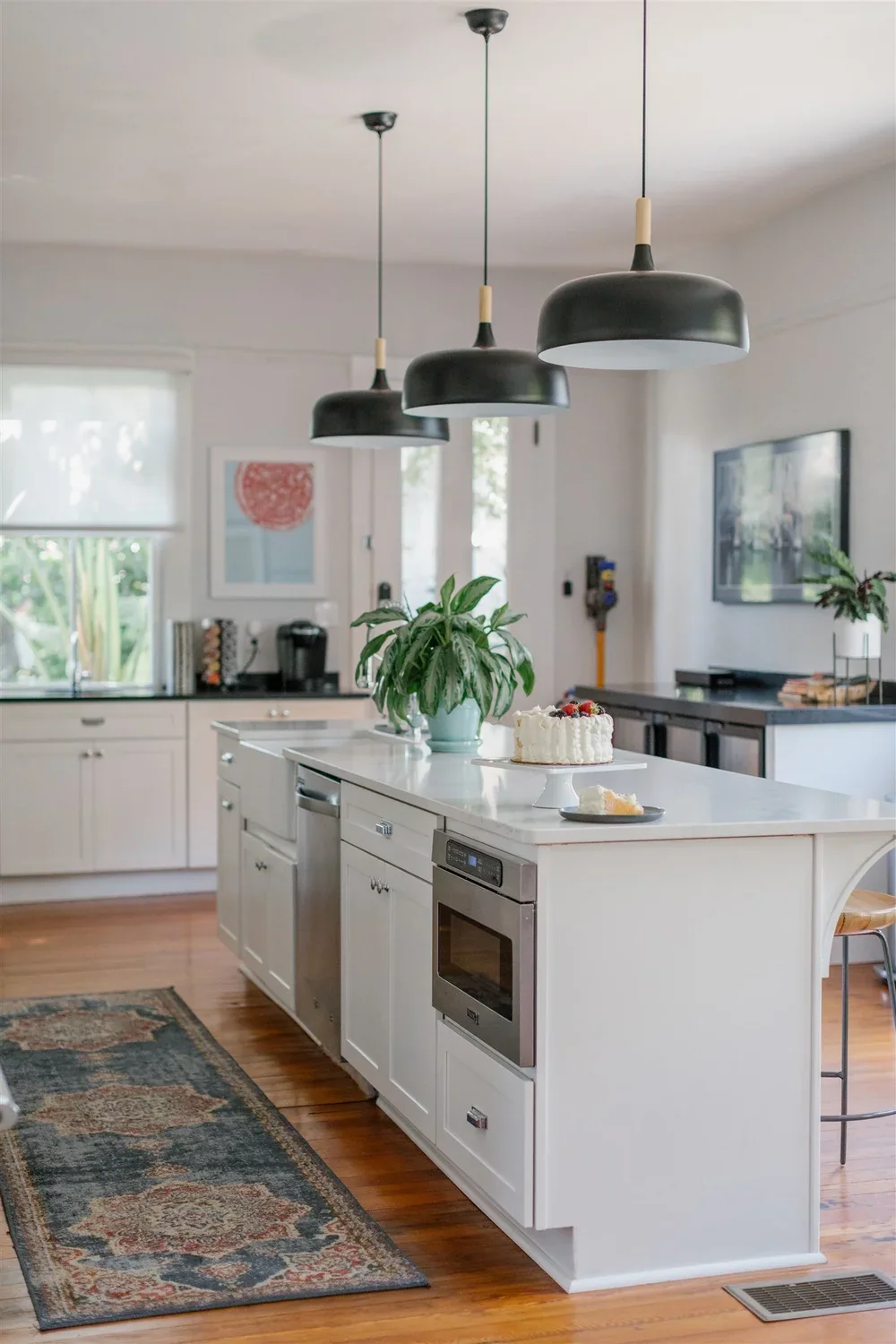 Kitchen with white cabinetry and stainless appliances