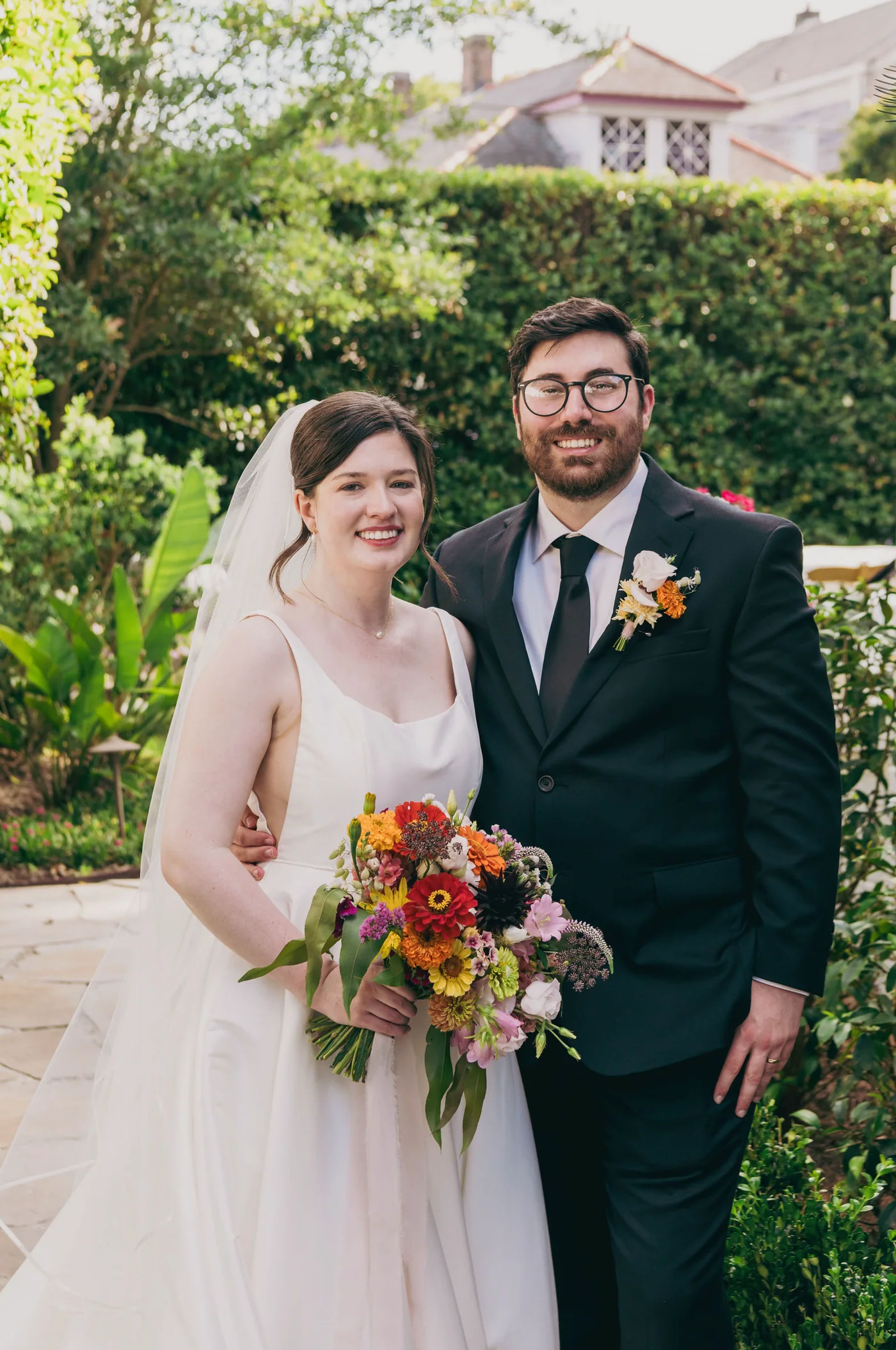 Wedding couple standing together in the garden